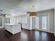 Bright kitchen with an island, stainless appliances, and white cabinetry at 4002 Hudson Ter, Tampa, FL 33618