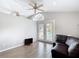 Bright living space with vaulted ceiling, ceiling fans, and view of the backyard pool at 4002 Hudson Ter, Tampa, FL 33618