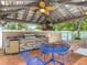 Outdoor kitchen with a grill, sink, and counter, perfect for entertaining at 4002 Hudson Ter, Tampa, FL 33618
