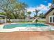 A beautiful backyard pool with a diving board and lots of room for activities at 4002 Hudson Ter, Tampa, FL 33618