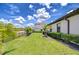 Lush backyard with green grass and landscaping, offering a serene outdoor space at 4122 Natural Vista Ct, New Port Richey, FL 34655