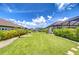 Expansive backyard featuring manicured lawn and tasteful landscaping at 4122 Natural Vista Ct, New Port Richey, FL 34655