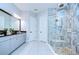 Featuring a walk-in shower, soaking tub and double sink vanity, this bathroom is both stylish and functional at 4122 Natural Vista Ct, New Port Richey, FL 34655