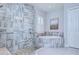 Luxurious bathroom boasting a soaking tub, tiled walls, and a seamless glass shower enclosure at 4122 Natural Vista Ct, New Port Richey, FL 34655