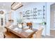 Open dining area with views of the kitchen and custom shelving for glassware at 4122 Natural Vista Ct, New Port Richey, FL 34655