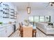 Spacious dining area features a custom bar and stylish lighting fixture at 4122 Natural Vista Ct, New Port Richey, FL 34655