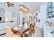 Elegant dining room with a modern chandelier, seamlessly connected to the kitchen, perfect for entertaining at 4122 Natural Vista Ct, New Port Richey, FL 34655