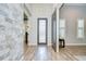 Welcoming entryway showcasing decorative tile flooring, modern lighting, and a stylish front door at 4122 Natural Vista Ct, New Port Richey, FL 34655