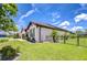 Attractive single-story home featuring a manicured lawn and a partial view of the fence at 4122 Natural Vista Ct, New Port Richey, FL 34655