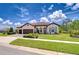 Stunning single-story home featuring a well-manicured lawn and elegant front door at 4122 Natural Vista Ct, New Port Richey, FL 34655