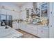 Modern kitchen with stainless steel appliances, stylish backsplash, and ample counter space for cooking and entertaining at 4122 Natural Vista Ct, New Port Richey, FL 34655