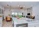 Open kitchen and dining area with modern decor, granite countertops, and stainless steel appliances, perfect for Gathering gatherings at 4122 Natural Vista Ct, New Port Richey, FL 34655