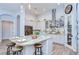 Bright kitchen with a spacious island, stainless steel appliances, and modern cabinetry, perfect for cooking and entertaining at 4122 Natural Vista Ct, New Port Richey, FL 34655
