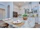 Elegant kitchen island featuring a granite countertop and seating, perfect for casual dining and meal preparation at 4122 Natural Vista Ct, New Port Richey, FL 34655
