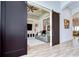 Open-concept living room with a comfortable gray leather sofa and stylish built-in shelving at 4122 Natural Vista Ct, New Port Richey, FL 34655