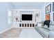Bright living room with custom built-ins, cabinets, and a wall-mounted television at 4122 Natural Vista Ct, New Port Richey, FL 34655