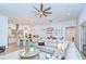 Open-concept living room and kitchen featuring modern decor and furnishings, creating a welcoming and stylish space at 4122 Natural Vista Ct, New Port Richey, FL 34655
