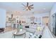 Open-concept living room and kitchen featuring modern decor and furnishings, creating a welcoming and stylish space at 4122 Natural Vista Ct, New Port Richey, FL 34655