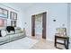 Living room featuring pocket doors that lead to a bonus space or den at 4122 Natural Vista Ct, New Port Richey, FL 34655