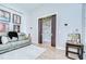 Living room featuring pocket doors that lead to a bonus space or den at 4122 Natural Vista Ct, New Port Richey, FL 34655