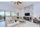 Comfortable living room with decorative stone wall accent and fireplace at 4122 Natural Vista Ct, New Port Richey, FL 34655