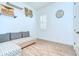 Bright room features wood-look tile flooring and comfortable seating, perfect for relaxing or entertaining at 4122 Natural Vista Ct, New Port Richey, FL 34655