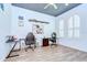 Bright and airy office space with wood-look tile flooring and plantation shutters at 4122 Natural Vista Ct, New Port Richey, FL 34655