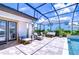 Screened lanai featuring ample seating around a sparkling pool and brick paver flooring at 4122 Natural Vista Ct, New Port Richey, FL 34655