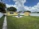 Spacious backyard featuring a patio, shed, and lush green lawn, perfect for outdoor activities at 4242 7Th N Ave, St Petersburg, FL 33713