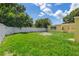 View of backyard featuring a grassy area, privacy fence, and space for outdoor activities at 4242 7Th N Ave, St Petersburg, FL 33713