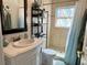 Neat bathroom featuring a vanity with a white vessel sink, a walk-in shower, and decorative accents at 4242 7Th N Ave, St Petersburg, FL 33713