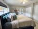Cozy bedroom with a plush bed, soft pillows, and neutral wall paint at 4242 7Th N Ave, St Petersburg, FL 33713