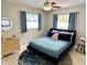 Well-lit bedroom featuring soft textures, decorative rug, and complementary furniture at 4242 7Th N Ave, St Petersburg, FL 33713