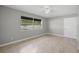 Bright bedroom with ceramic tile floors, neutral walls, and a ceiling fan at 4242 7Th N Ave, St Petersburg, FL 33713