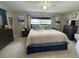 Comfortable bedroom featuring a large bed, dresser, and neutral-toned walls and flooring at 4242 7Th N Ave, St Petersburg, FL 33713