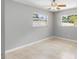 Bright bedroom featuring ceramic tile floors, neutral walls, and a ceiling fan at 4242 7Th N Ave, St Petersburg, FL 33713