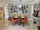 Light and airy dining room featuring tile floors, modern lighting, and contemporary decor at 4242 7Th N Ave, St Petersburg, FL 33713