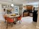 View of dining room and kitchen area featuring updated appliances and modern furnishings at 4242 7Th N Ave, St Petersburg, FL 33713
