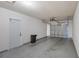 An empty garage with a closed garage door and a door to the interior at 4242 7Th N Ave, St Petersburg, FL 33713
