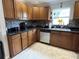 Kitchen with stainless steel appliances, ample counter space, and wooden cabinetry at 4242 7Th N Ave, St Petersburg, FL 33713