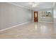 Neutral living room boasts natural light, decorative trim, and tile flooring at 4242 7Th N Ave, St Petersburg, FL 33713
