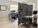 Home office space with desks, computer monitors, and a decorative folding screen at 4242 7Th N Ave, St Petersburg, FL 33713