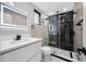 Modern bathroom featuring marble walls, a glass shower, and a sleek vanity with an LED mirror at 4313 Riviera Ct, Spring Hill, FL 34608
