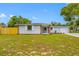 Charming single Gathering home with a well maintained lawn, neutral paint, brick details and attached garage at 4313 Riviera Ct, Spring Hill, FL 34608
