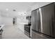 Modern kitchen with stainless steel appliances, white cabinets and an island with modern pendant lighting at 4313 Riviera Ct, Spring Hill, FL 34608