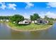 Beautiful waterfront home with a well-maintained backyard overlooking a serene lake at 4407 Whitton Way, New Port Richey, FL 34653