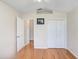 A bright bedroom with hardwood floors, large closet and neutral paint at 4407 Whitton Way, New Port Richey, FL 34653