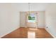Dining room with chandelier and large window overlooking the water at 4407 Whitton Way, New Port Richey, FL 34653