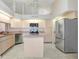 Bright kitchen with stainless appliances and island at 4407 Whitton Way, New Port Richey, FL 34653