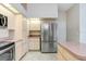 Kitchen featuring stainless steel refrigerator and lots of cabinet space at 4407 Whitton Way, New Port Richey, FL 34653